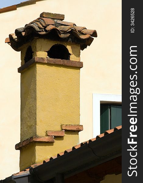 Central chimney of an ancient building in Portogruaro, Italy