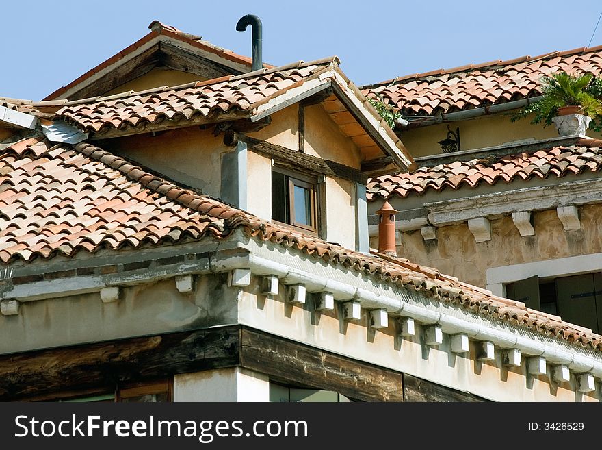 Roof and upper floor of an old historical building in Portogruaro, Italy