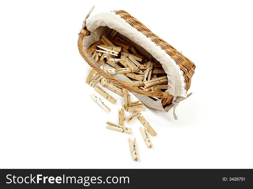 Old fashioned laundry basket with clothespins