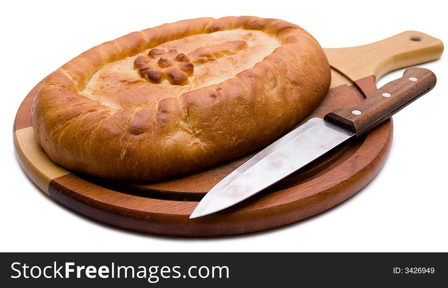 Celebratory pie on a chopping board with a knife. Celebratory pie on a chopping board with a knife.