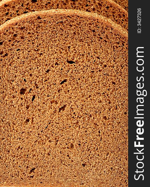 Cut of a rye bread, background