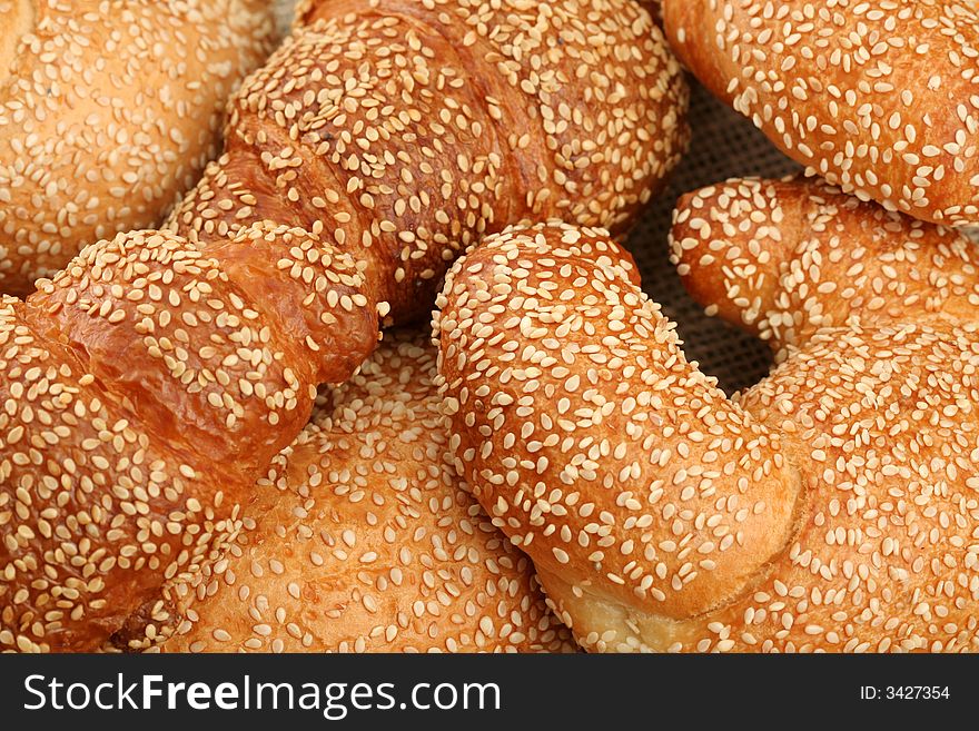 Fresh sweet rolls with sesame, background