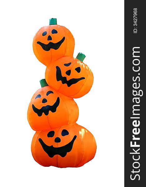 Four blowup pumpkins stacked on top of each other.  Smiling faces. Four blowup pumpkins stacked on top of each other.  Smiling faces.