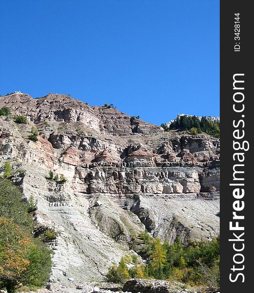 Hillside in the mountains in nature with rocks grass and other plants. Hillside in the mountains in nature with rocks grass and other plants