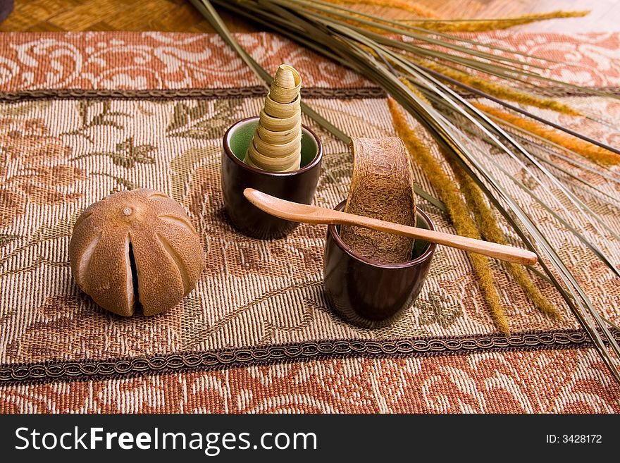 Showing a dried leaves tangering orange petals and wooden spoon. Showing a dried leaves tangering orange petals and wooden spoon.