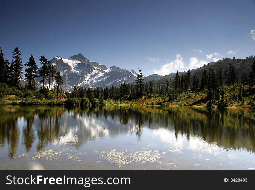 Mt Shuksan reflected in beautiful Picture Lake.  Located near Mt Baker in the northern Cascade range of Washington State.