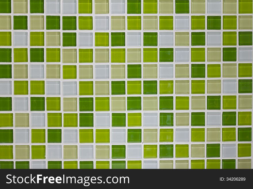 Green glass mosaic tiles wall in the kitchen. Green glass mosaic tiles wall in the kitchen