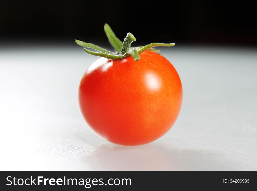 Tomato fruit on dark background
