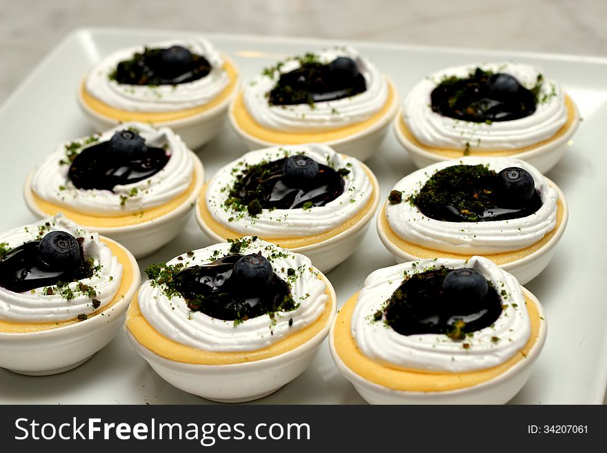Blueberry cheesecake decorations with cream