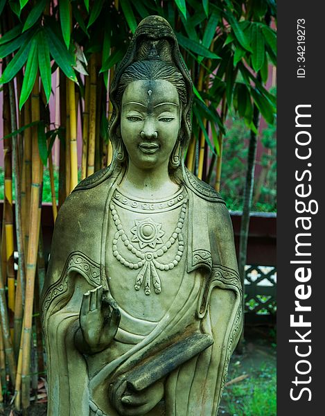 Statue of a woman in Thailand temple