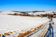 Road To Old Village Along A Snowy Slope In Winter Royalty Free Stock Image Road To Old Village Along A Snowy Slope In Winter Royalty Free Stock Image