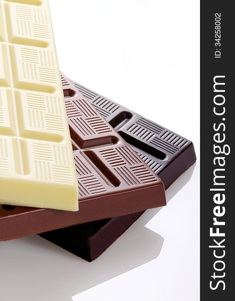 Chocolate bars on white background with overhead shot. Chocolate bars on white background with overhead shot