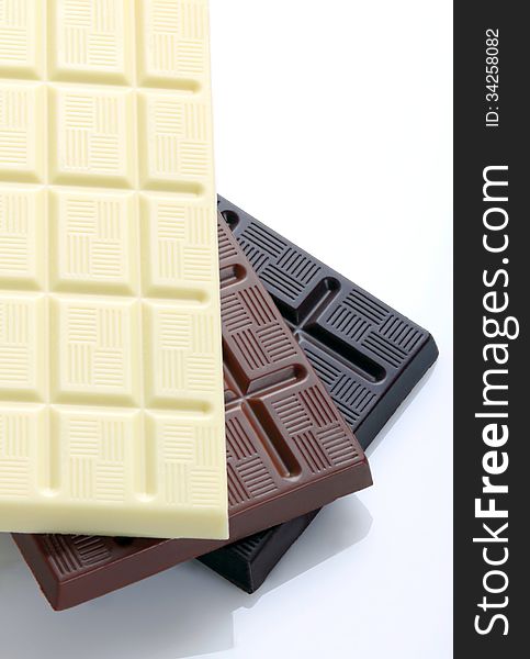 Chocolate bars on white background with overhead shot. Chocolate bars on white background with overhead shot