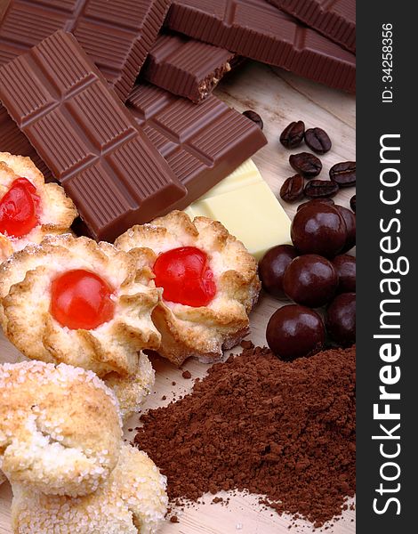 Pastries and chocolate bars in the foreground with overhead shot. Pastries and chocolate bars in the foreground with overhead shot