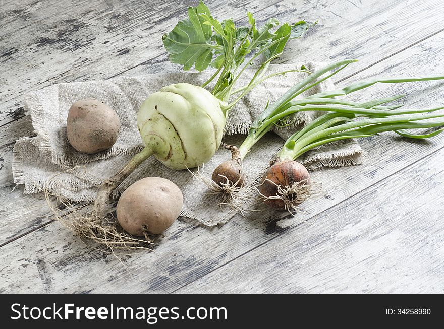 Fresh vegetables on old wooden table