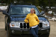 Teen Girl Standing In Front Of An SUV Royalty Free Stock Images Teen Girl Standing In Front Of An SUV Royalty Free Stock Images