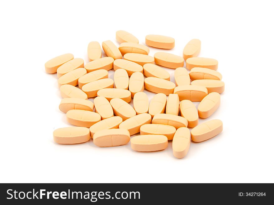 Vitamin pills on a white background