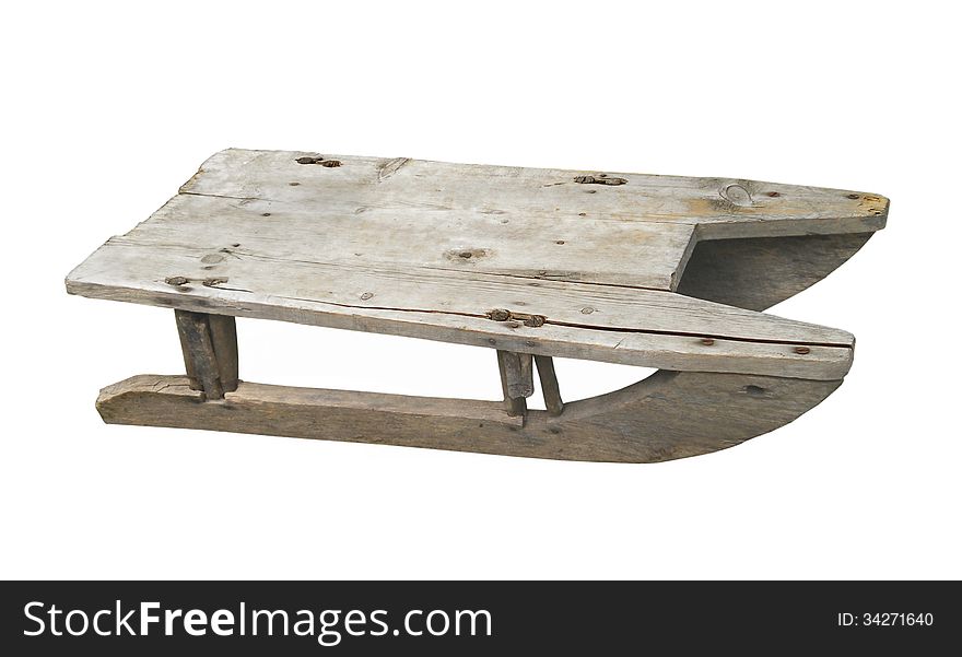 Old child’s wooden sled isolated