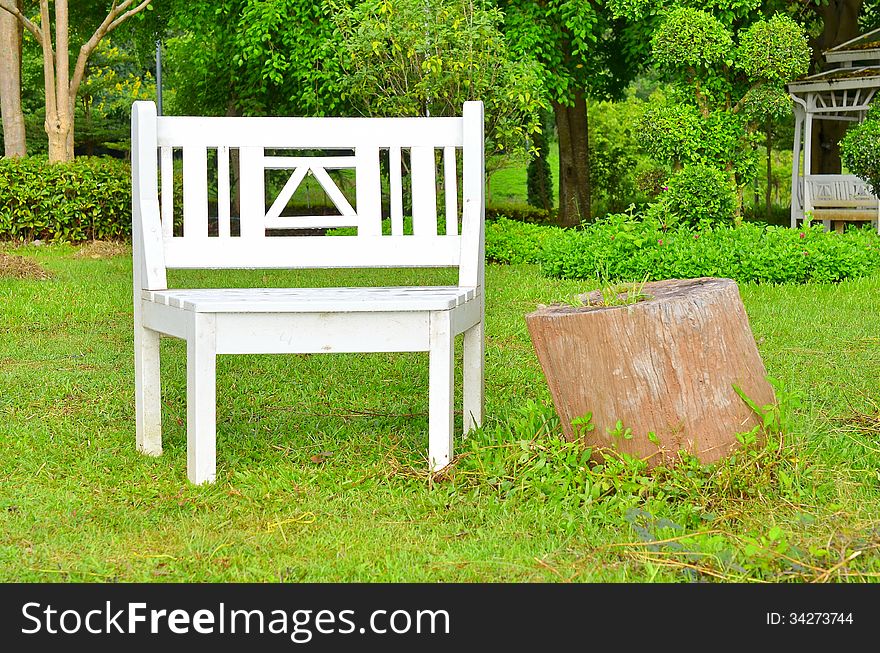 White bench for relax in garden
