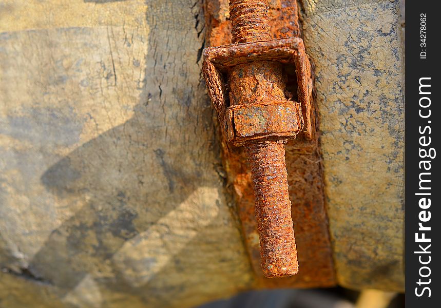 Old rusty bolt on sunshine