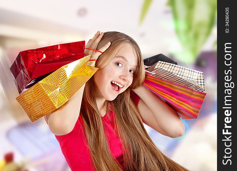 Beautiful girl holding shopping bags