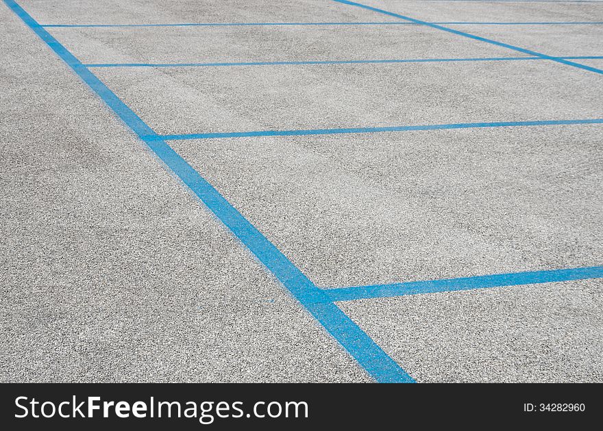 Empty Parking Spaces With Blue Stripes