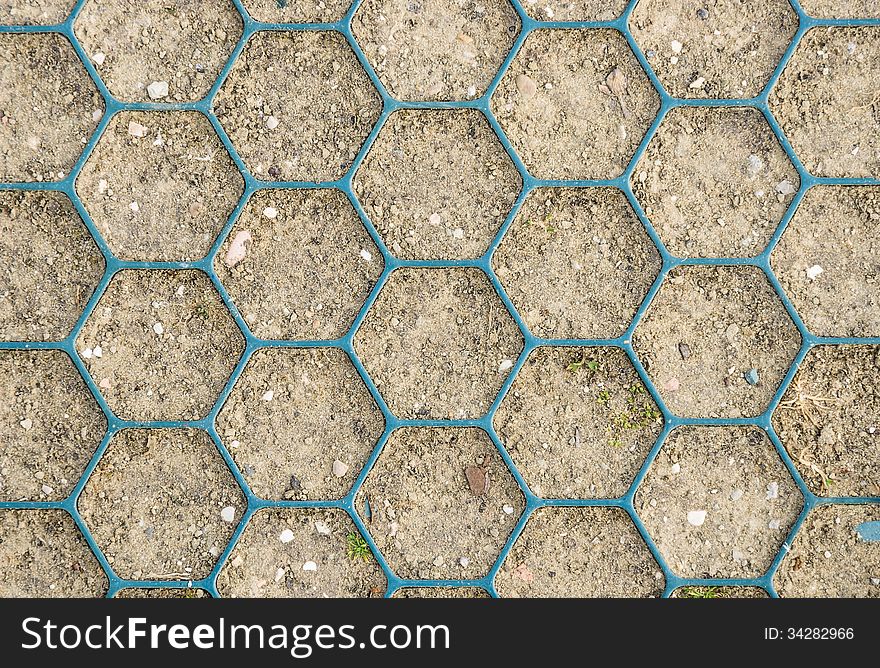 Detail of an honeycomb pattern on ground.