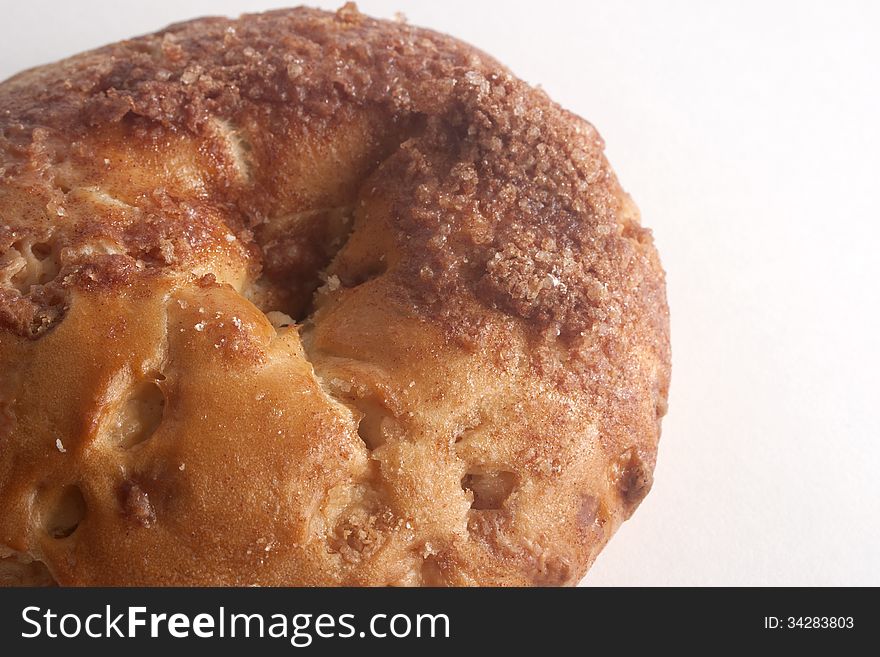 Single sweet tasty cinnamon bagel closeup