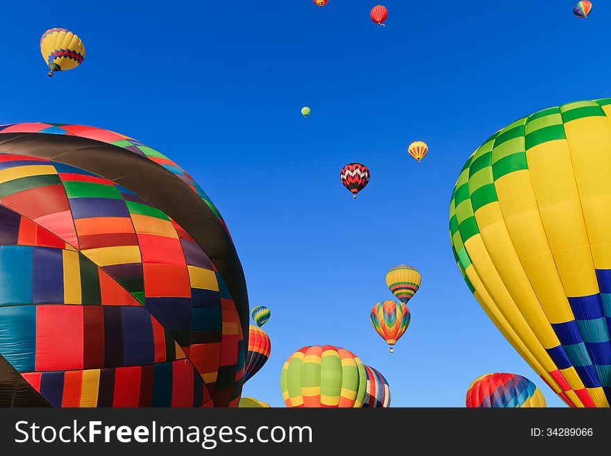 Colorful hot air balloons against blue sky