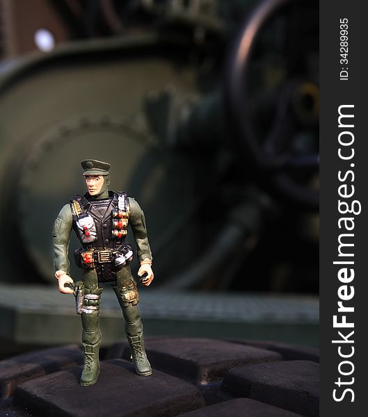Toy soldier at army vehicle