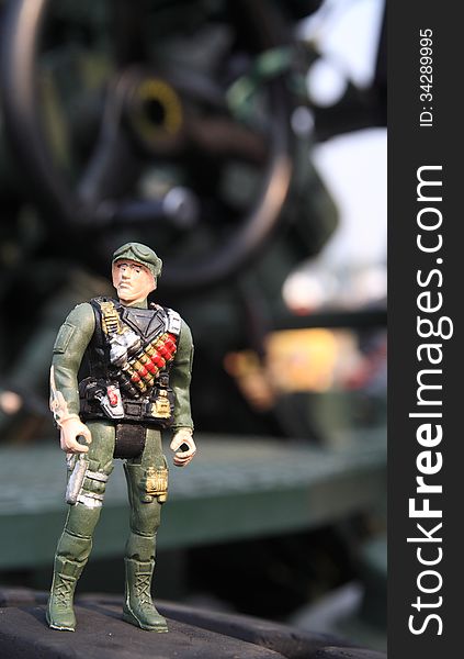 Toy soldier at army vehicle