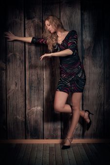 Beautiful Lady Dancing Over Wooden Wall Background Royalty Free Stock Photo