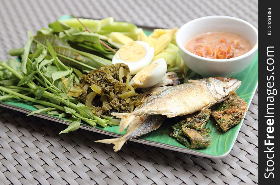 Fried Mackerel fish,chili sauce and fried vegetable.