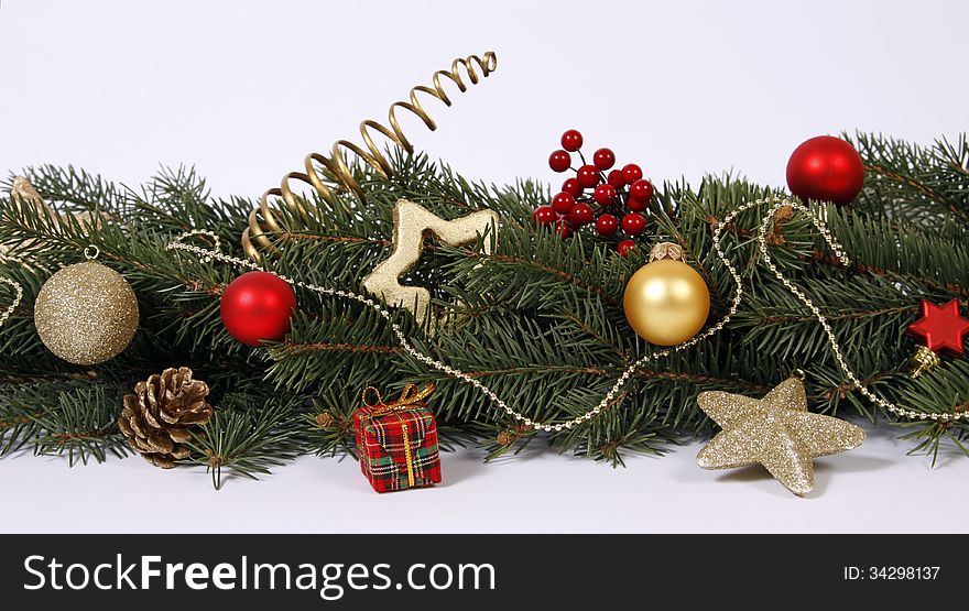 Christmas decoration with the twigs of the spruce and baubles