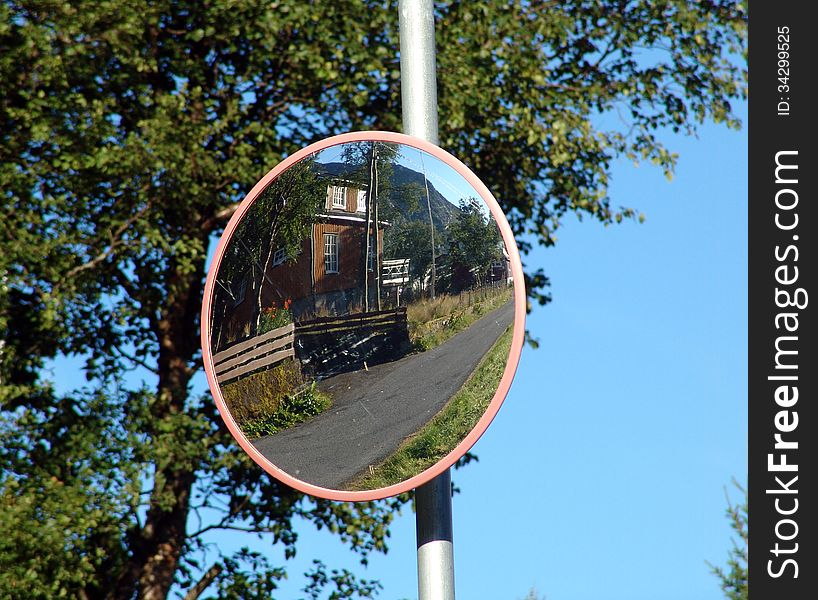 Convex mirror at the intersection for traffic safety. Convex mirror at the intersection for traffic safety