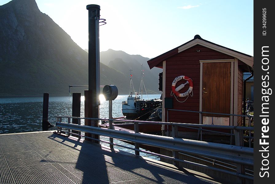 The ferry mooring in the Norwegian fjord. The ferry mooring in the Norwegian fjord