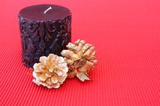 Candle And Pine Cones Stock Images