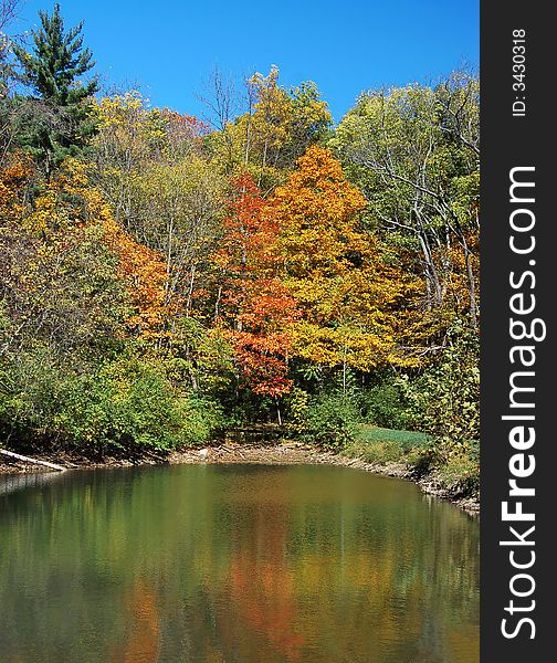 Autumn lake surrounded by fall foliage