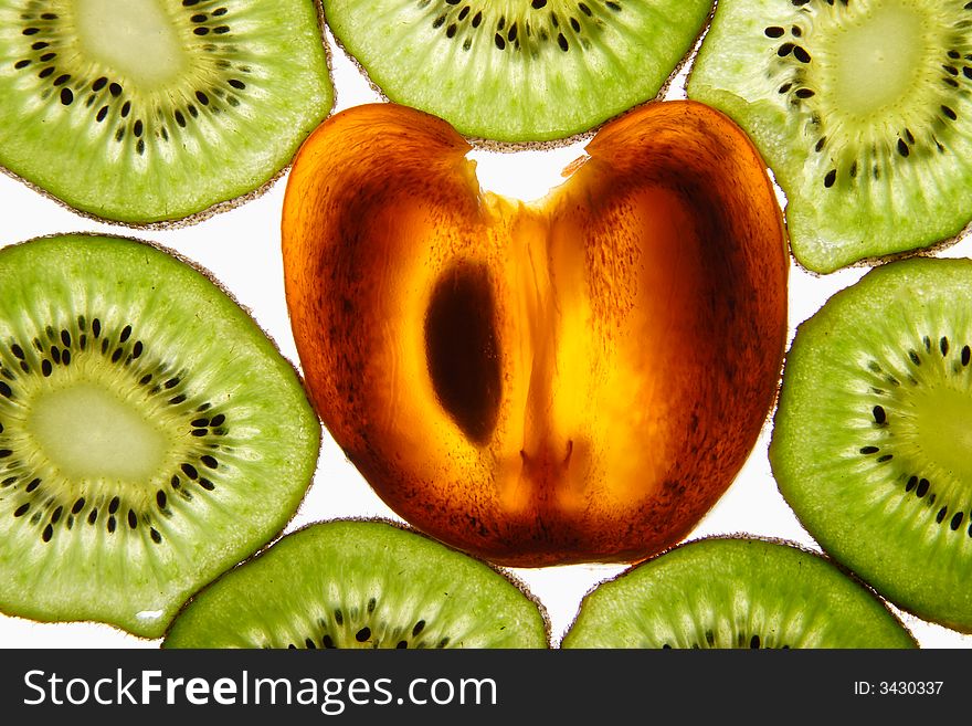 Kiwi and persimmon on a white background