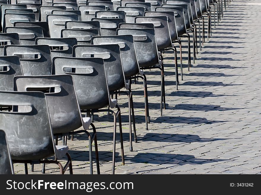 Empty chairs at the square