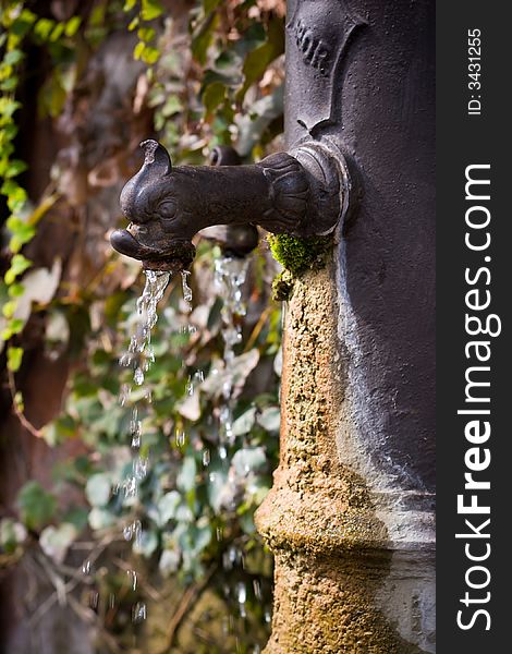 Old drinking fountain and drops