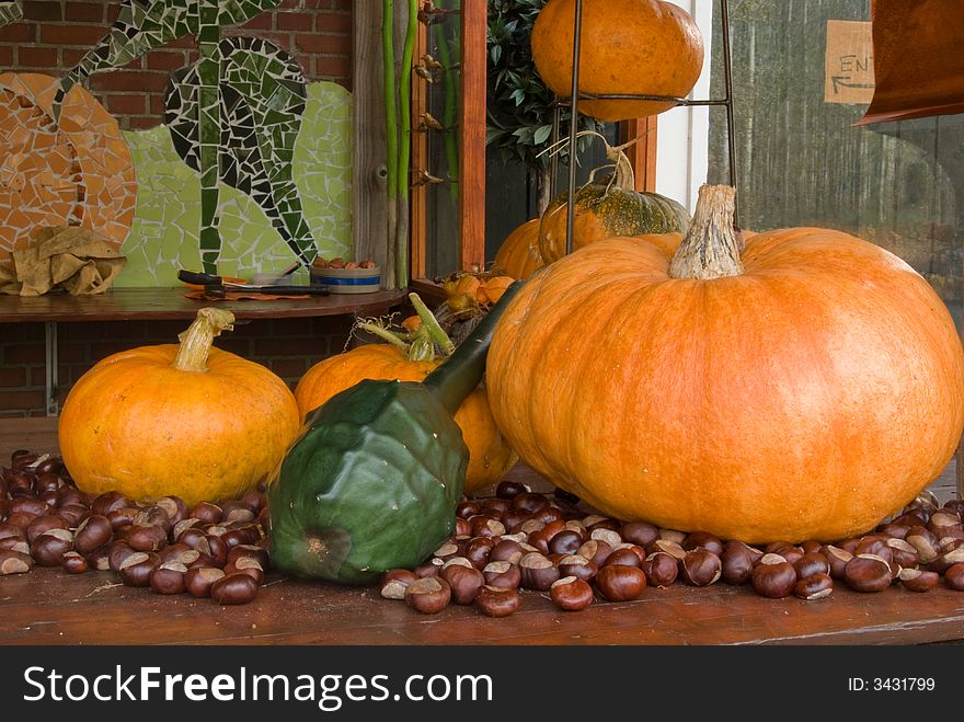 Autum decoration pumpkins with chestnuts