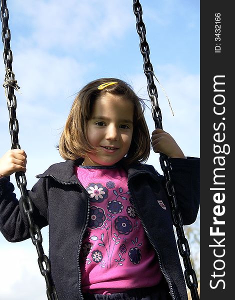 Little girl being playing on grass field. Little girl being playing on grass field