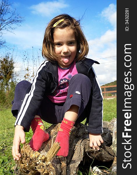 Little girl being silly on grass field. Little girl being silly on grass field