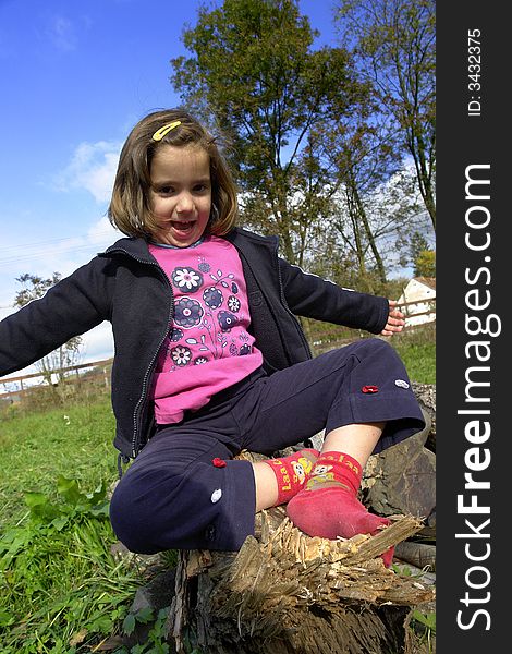 Little girl being silly on grass field. Little girl being silly on grass field