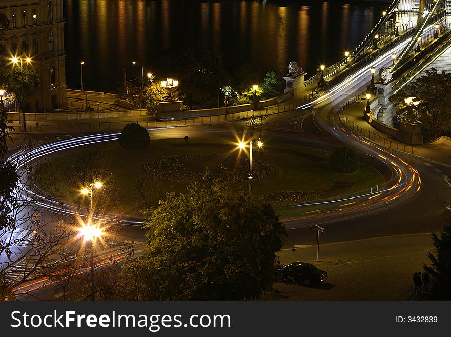 Night circle car light in my city. Circle center park. Background the chain bridge. Night circle car light in my city. Circle center park. Background the chain bridge.