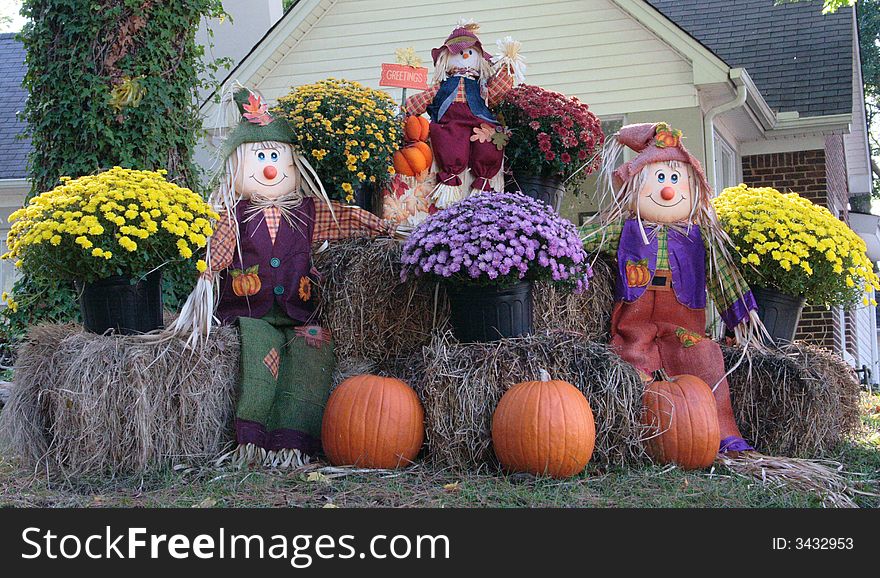 An autumn yard full of hay and ornaments. An autumn yard full of hay and ornaments.