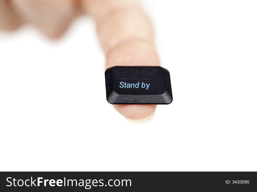 Finger holding the stand by key, on white background