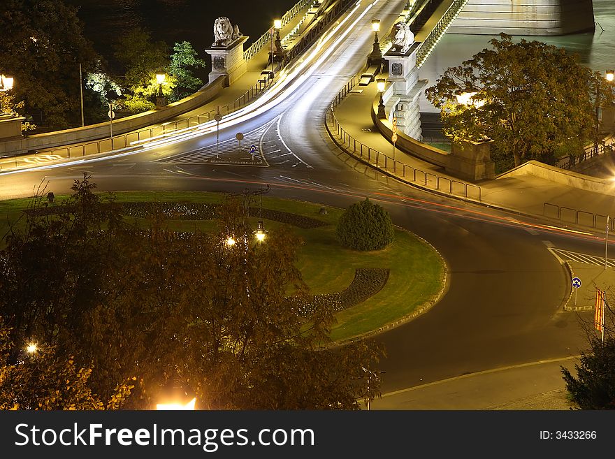 Night circle car light in Budapest. Circle center park. Background the chain bridge. Night circle car light in Budapest. Circle center park. Background the chain bridge.