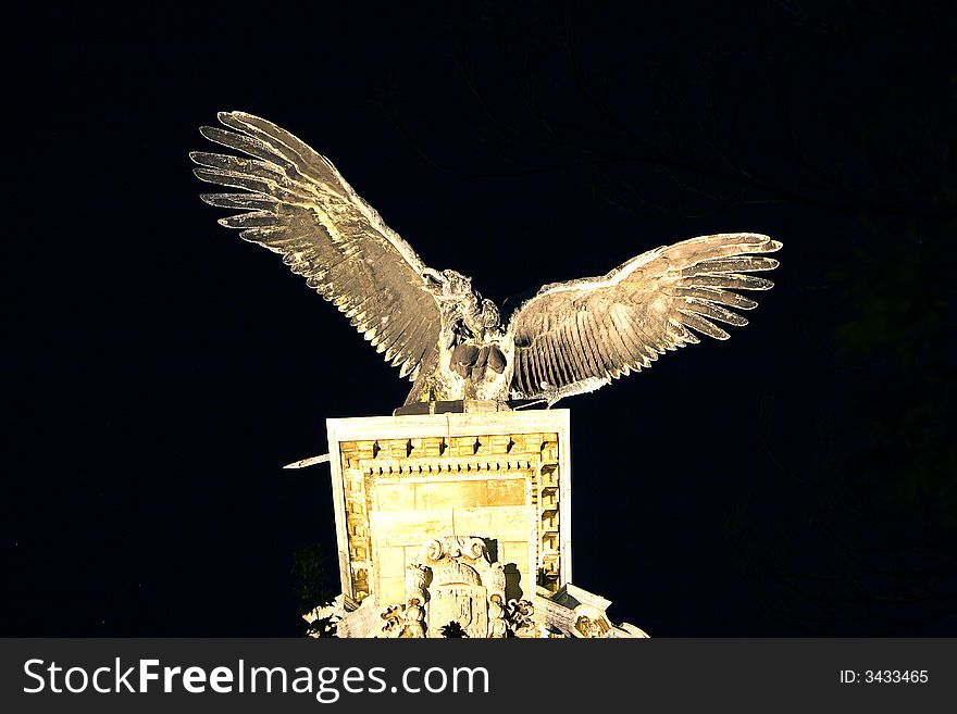 Stone bird statue in night light from Hungary, Budapest. Stone bird statue in night light from Hungary, Budapest